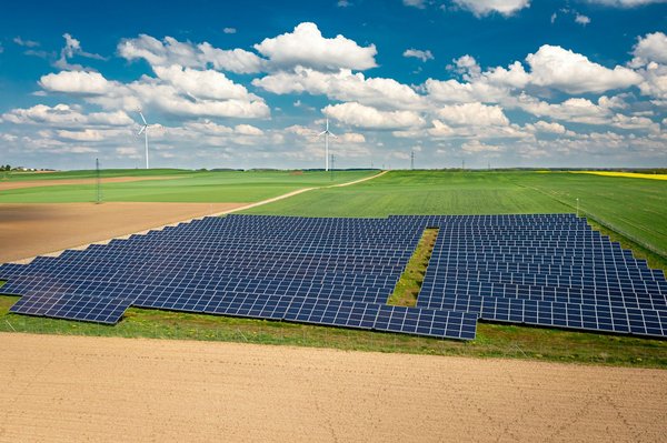 What are the strategies for creating zero-energy real estate developments through sustainable design and technology?